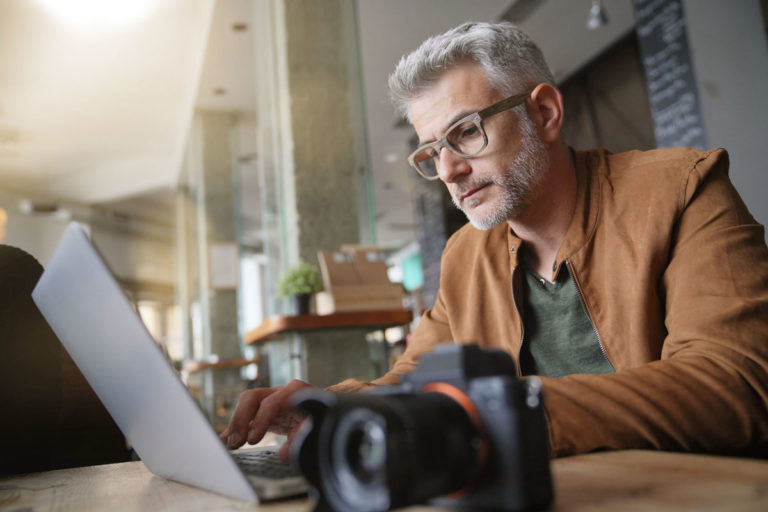 Photographer sitting at computer