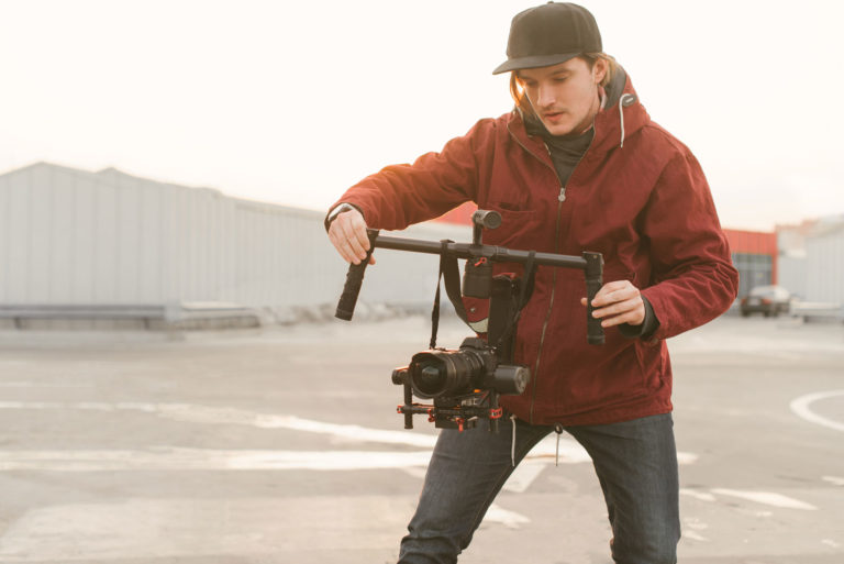 videographer holding large gimbal steady