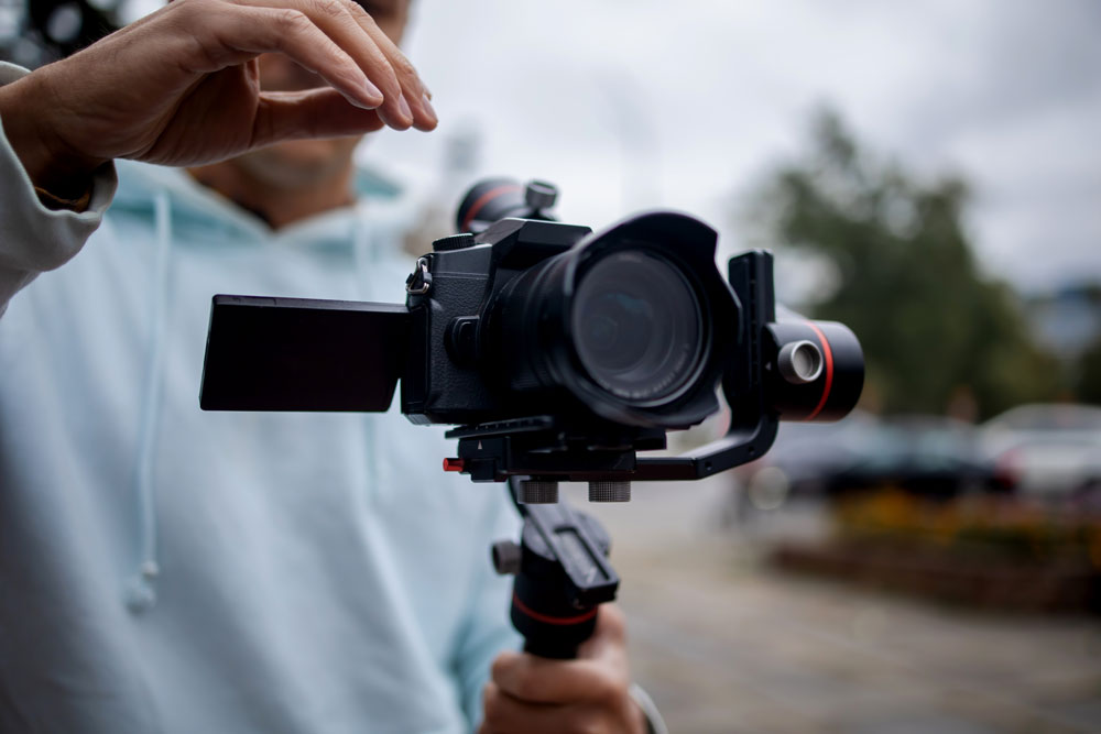 videographer setting up the angle of the camera