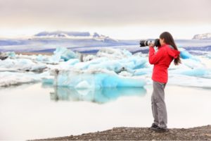 Woman photographer capturing the wintry atmosphere