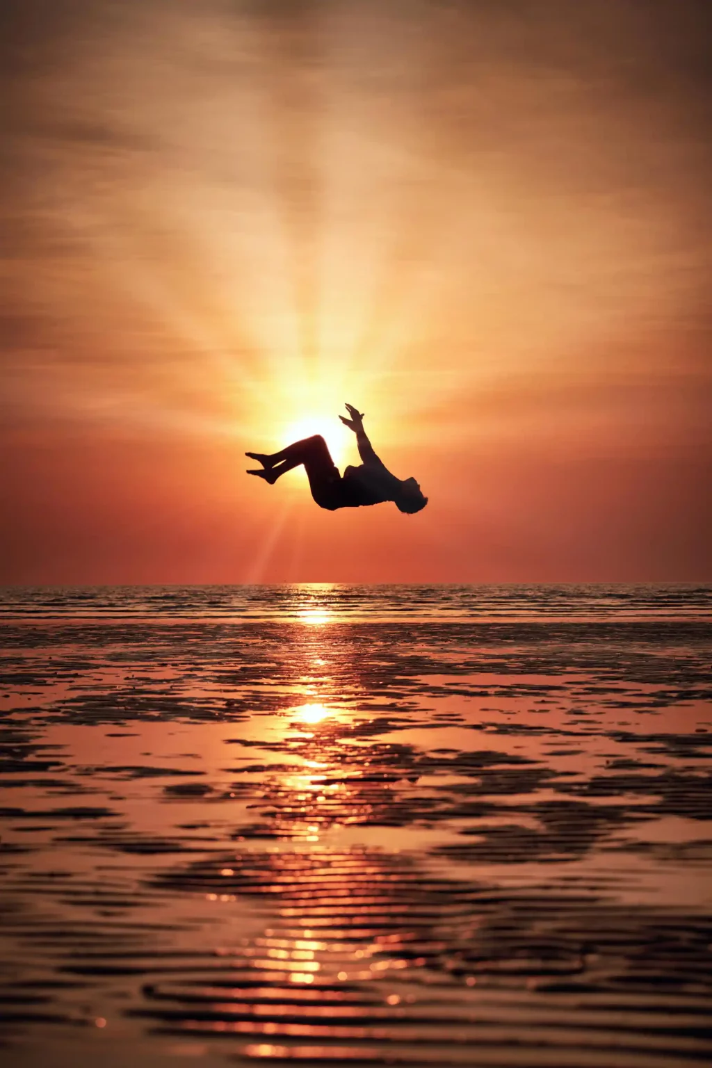 SmugMug photo of guy in air over water