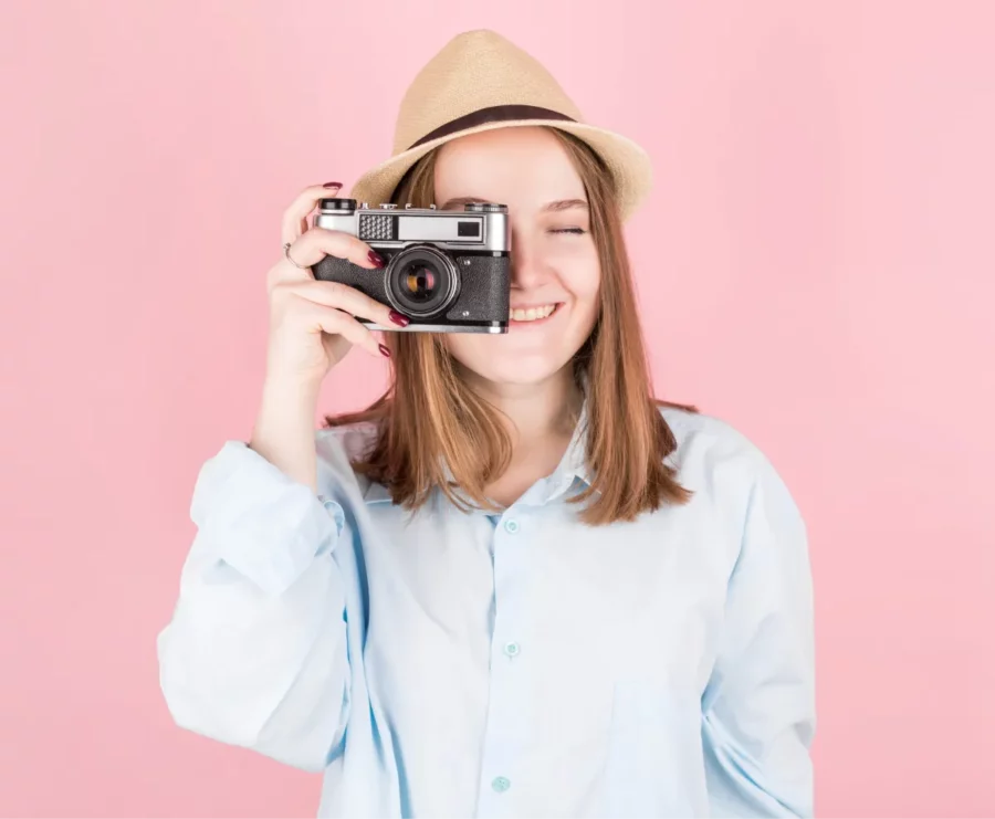 Female photojournalist with old-time camera