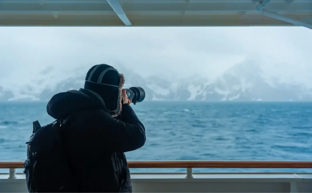 A photographer capturing images of the artic