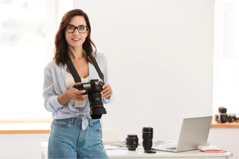 A photographer standing inside her home office.