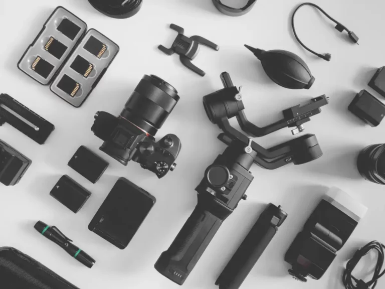 Videographer gear stretched out along a table.